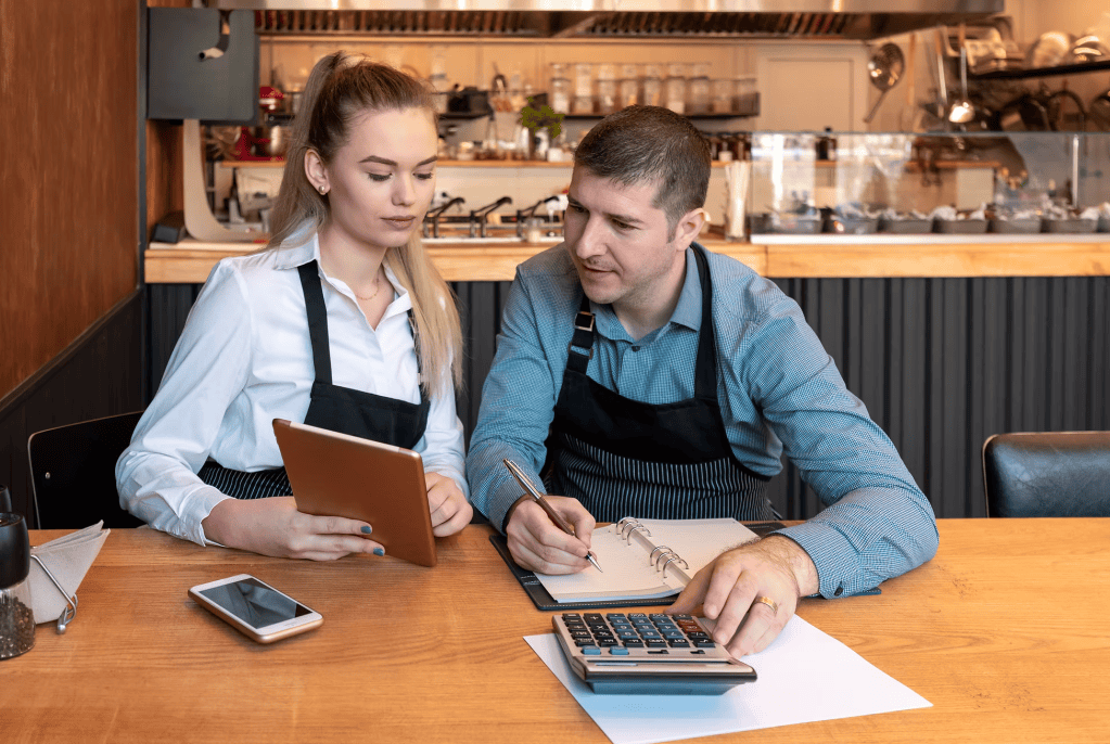 coffee shop employees doing accounting